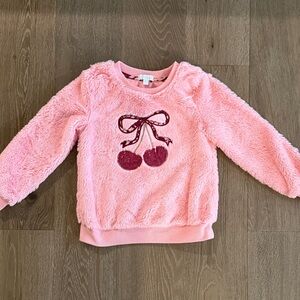 Between pink fuzzy cherries sweater. Size:6. Gently Used.